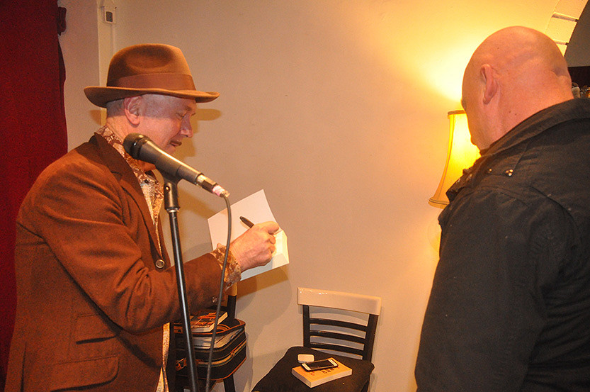 Self-deprecating singer does solo book signing